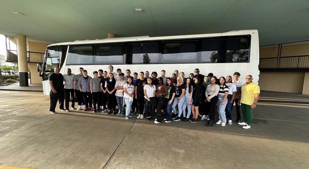 Student group in front of a JGT coach